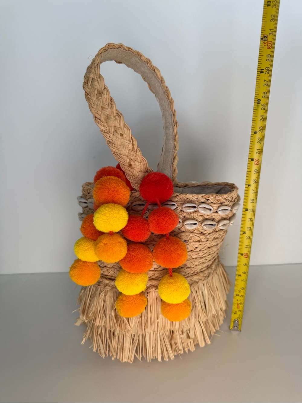 Hat Attack Straw Raffia Bucket Bag with Shells + Pom Pom Charm